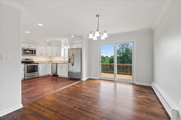 Chandelier, Interior, Kitchen, Pendant Lights, Recessed Lighting, Stainless Steel Appliances, Wood Texture Flooring