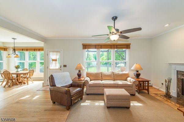 Dining room, Fireplace, Interior, Living room, Pendant Lights, Recessed Lighting, Wood Texture Flooring