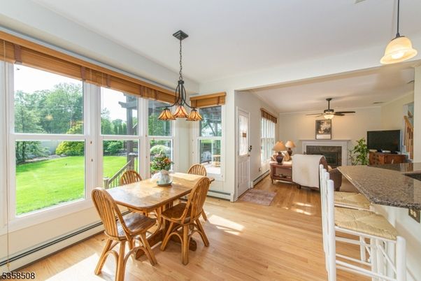 Dining room, Fireplace, Interior, Living room, Pendant Lights, Wood Texture Flooring