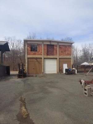Attached, Backyard, Exterior, Facade, Brick Facade, None