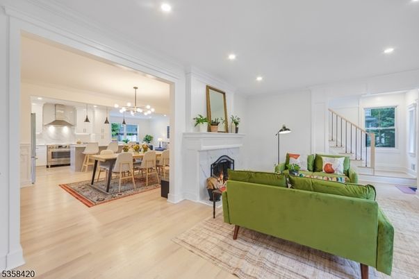 Dining room, Fireplace, Interior, Kitchen, Living room, Pendant Lights, Recessed Lighting, Stainless Steel Appliances, Wood Texture Flooring