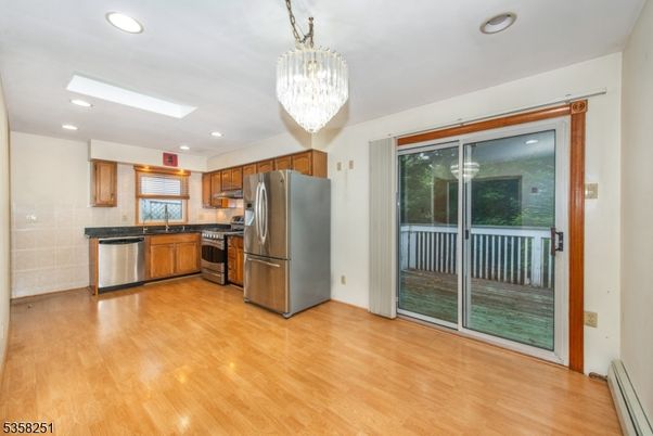 Chandelier, Interior, Kitchen, Recessed Lighting, Stainless Steel Appliances, Wood Texture Flooring