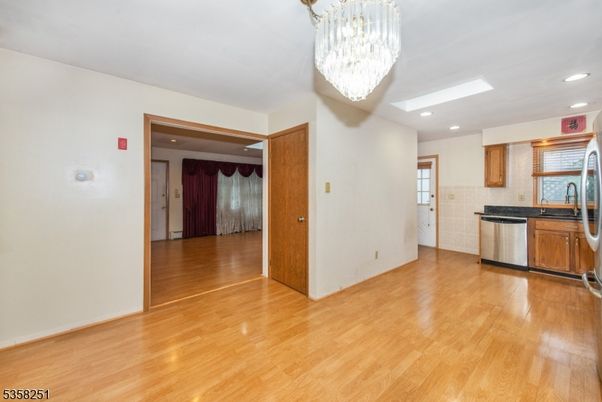 Chandelier, Interior, Kitchen, Recessed Lighting, Stainless Steel Appliances, Wood Texture Flooring