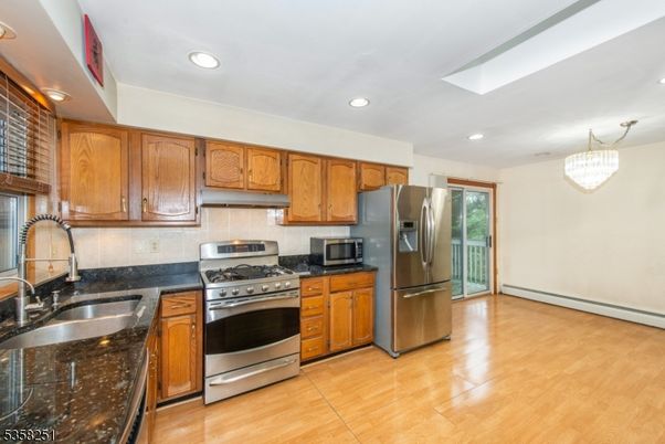 Chandelier, Interior, Kitchen, Recessed Lighting, Stainless Steel Appliances, Wood Texture Flooring