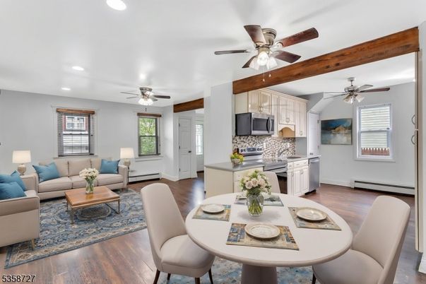 Dining room, Interior, Kitchen, Living room, Recessed Lighting, Stainless Steel Appliances, Wood Texture Flooring