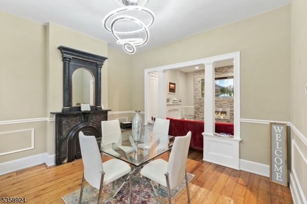 Dining room, Fireplace, Interior, Pendant Lights, Recessed Lighting, Wood Texture Flooring