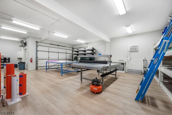 Fitness Equipment, Game Room, Garage, Interior, Wood Texture Flooring