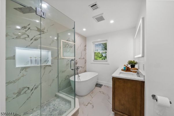Bathroom, Free Standing Baths, Glass Shower, Interior, Marble, Marble Walls, Recessed Lighting