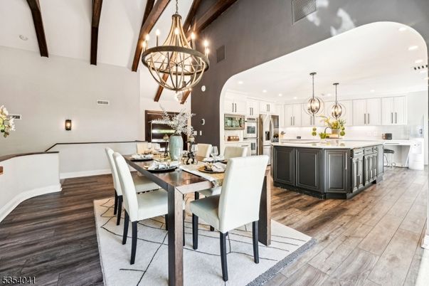 Chandelier, Dining room, Interior, Kitchen, Pendant Lights, Recessed Lighting, Stainless Steel Appliances, Wooden Beams, Wood Texture Flooring
