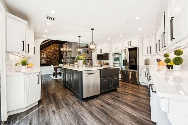 Dining room, Interior, Kitchen, Pendant Lights, Recessed Lighting, Stainless Steel Appliances, Stone Walls, Wood Texture Flooring
