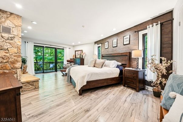 Bedroom, Fireplace, Interior, Recessed Lighting, Stone Walls, Wood Texture Flooring