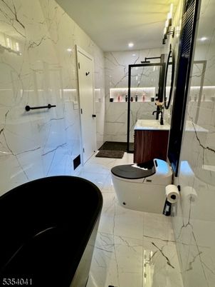 Bathroom, Free Standing Baths, Glass Shower, Interior, Marble, Marble Walls, Recessed Lighting