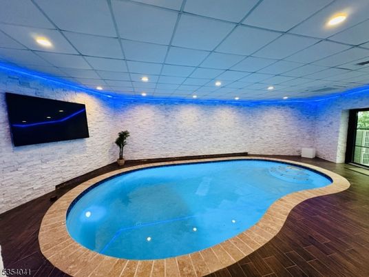 Interior, Pool, Recessed Lighting, Stone Walls, Wood Texture Flooring