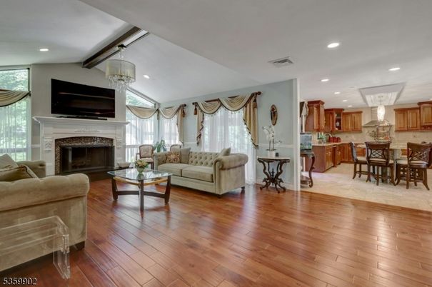Chandelier, Dining room, Fireplace, Interior, Kitchen, Living room, Recessed Lighting, Wood Texture Flooring
