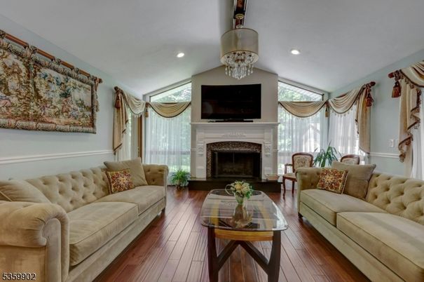 Chandelier, Fireplace, Interior, Living room, Recessed Lighting, Wood Texture Flooring