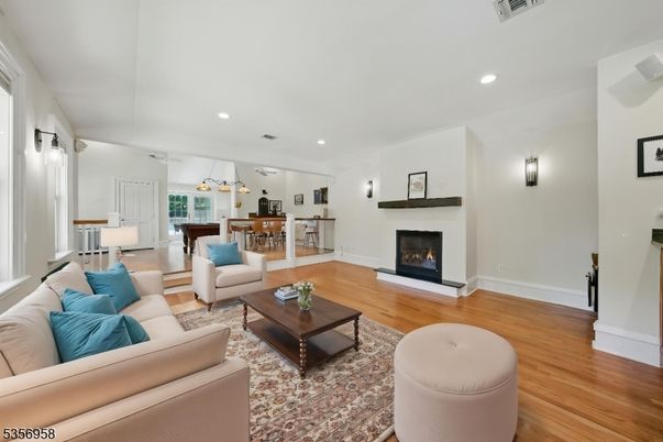 Dining room, Fireplace, Interior, Living room, Pendant Lights, Recessed Lighting, Wood Texture Flooring