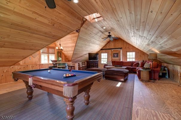 Billiard Table, Fireplace, Game Room, Interior, Living room, Recessed Lighting, Wooden Ceilings, Wood Texture Flooring, Wooden Walls