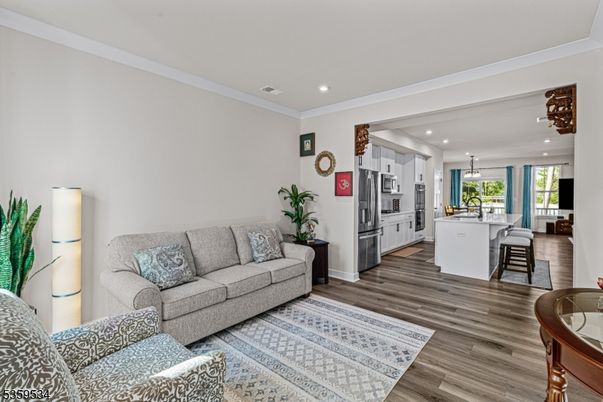 Dining room, Interior, Kitchen, Living room, Pendant Lights, Recessed Lighting, Stainless Steel Appliances, Wood Texture Flooring