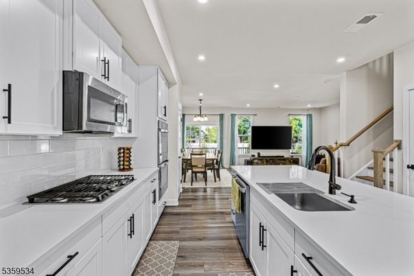 Dining room, Interior, Kitchen, Pendant Lights, Recessed Lighting, Stainless Steel Appliances, Wood Texture Flooring
