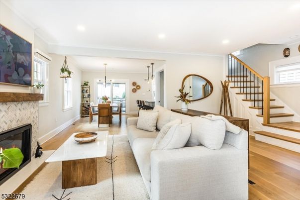 Dining room, Fireplace, Interior, Living room, Pendant Lights, Recessed Lighting, Wood Texture Flooring