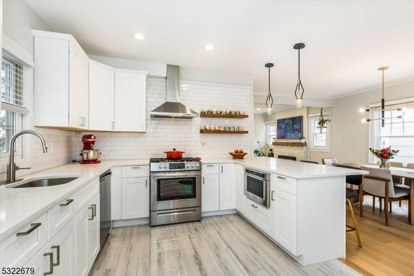 Dining room, Interior, Kitchen, Pendant Lights, Recessed Lighting, Stainless Steel Appliances, Wood Texture Flooring