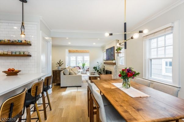 Dining room, Fireplace, Interior, Living room, Pendant Lights, Recessed Lighting, Wood Texture Flooring