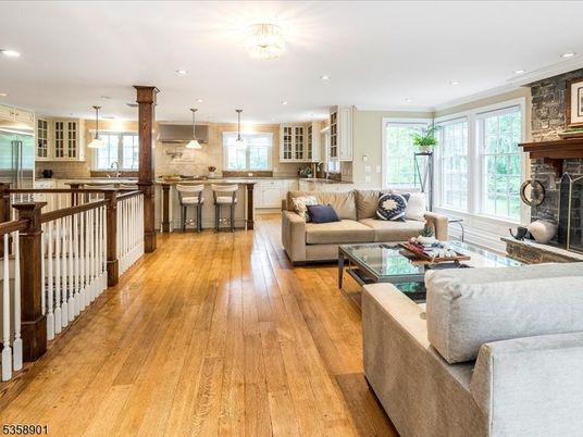 Fireplace, Interior, Kitchen, Living room, Pendant Lights, Recessed Lighting, Stainless Steel Appliances, Stone Walls, Wood Texture Flooring