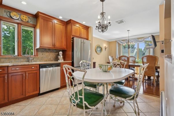 Chandelier, Dining room, Interior, Kitchen, Recessed Lighting, Stainless Steel Appliances, Wood Texture Flooring