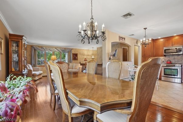 Chandelier, Dining room, Interior, Kitchen, Stainless Steel Appliances, Wood Texture Flooring