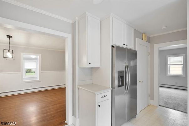 Empty room, Interior, Kitchen, Pendant Lights, Stainless Steel Appliances, Wood Texture Flooring