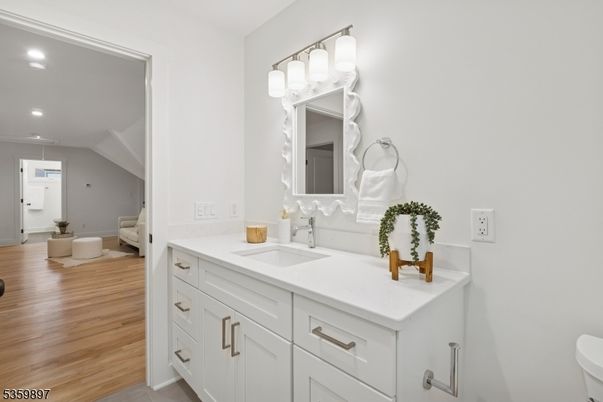 Bathroom, Dual Sink Vanities, Interior, Recessed Lighting, Wood Texture Flooring