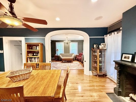 Chandelier, Dining room, Fireplace, Interior, Living room, Recessed Lighting, Wood Texture Flooring
