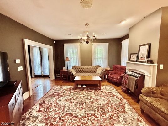 Chandelier, Fireplace, Interior, Living room, Recessed Lighting, Wood Texture Flooring