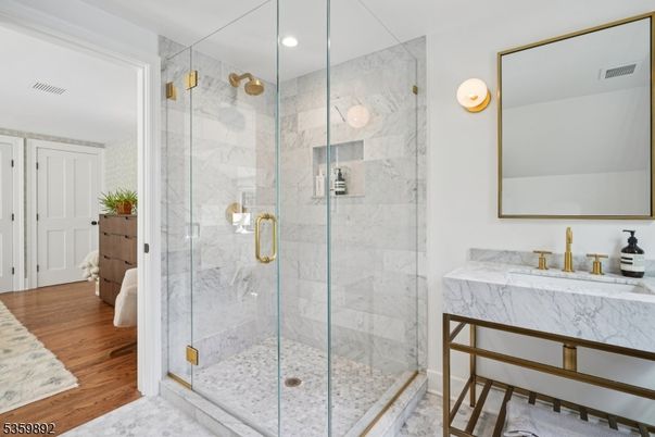 Bathroom, Glass Shower, Interior, Marble Walls, Recessed Lighting, Wood Texture Flooring
