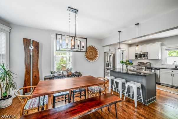 Dining room, Interior, Kitchen, Pendant Lights, Recessed Lighting, Stainless Steel Appliances, Wood Texture Flooring