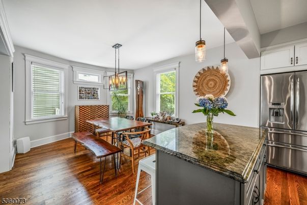 Chandelier, Dining room, Interior, Kitchen, Pendant Lights, Stainless Steel Appliances, Wood Texture Flooring