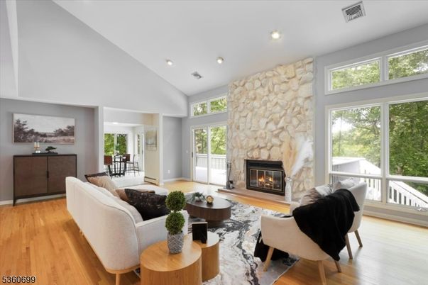 Fireplace, Interior, Living room, Recessed Lighting, Stone Walls, Wood Texture Flooring