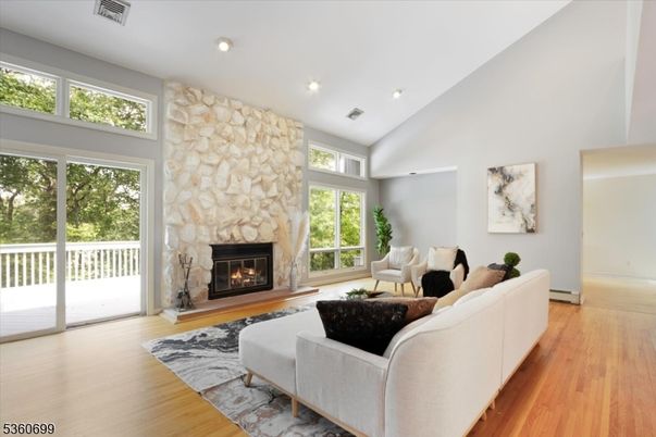 Fireplace, Interior, Living room, Recessed Lighting, Stone Walls, Wood Texture Flooring