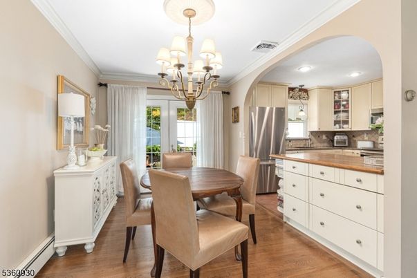 Chandelier, Dining room, Interior, Kitchen, Recessed Lighting, Stainless Steel Appliances, Wood Texture Flooring