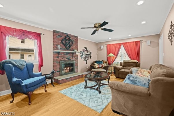 Fireplace, Interior, Living room, Recessed Lighting, Stone Walls, Wood Texture Flooring