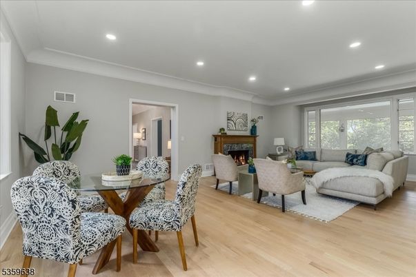 Dining room, Fireplace, Interior, Living room, Recessed Lighting, Wood Texture Flooring