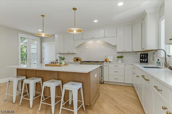 Interior, Kitchen, Marble Walls, Pendant Lights, Recessed Lighting, Wood Texture Flooring