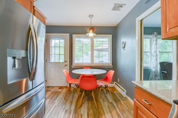 Dining room, Interior, Kitchen, Pendant Lights, Stainless Steel Appliances, Wood Texture Flooring