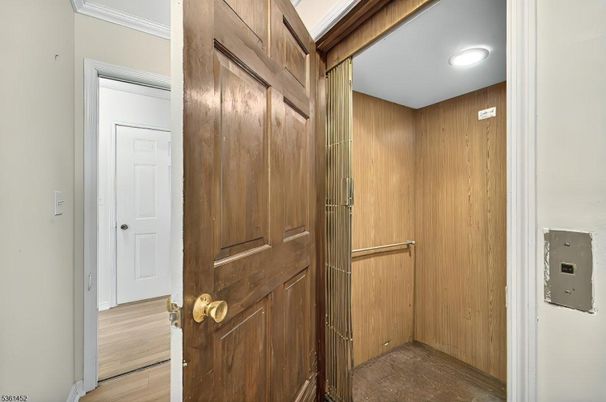 Elevator, Interior, Recessed Lighting, Wood Texture Flooring, Wooden Walls