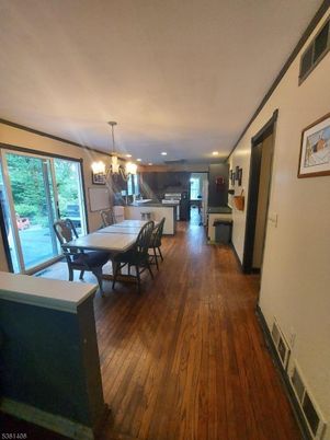 Chandelier, Dining room, Interior, Kitchen, Recessed Lighting, Stainless Steel Appliances, Wood Texture Flooring