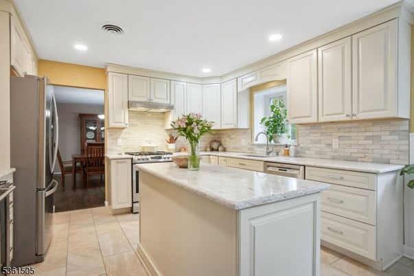 Dining room, Interior, Kitchen, Recessed Lighting, Stainless Steel Appliances, Wood Texture Flooring