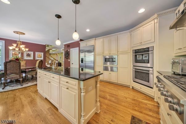 Chandelier, Dining room, Interior, Kitchen, Pendant Lights, Recessed Lighting, Stainless Steel Appliances, Wood Texture Flooring