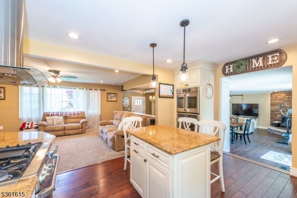 Dining room, Fireplace, Interior, Kitchen, Living room, Pendant Lights, Recessed Lighting, Stone Walls, Wood Texture Flooring