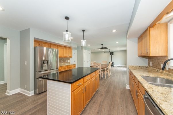 Dining room, Interior, Kitchen, Pendant Lights, Recessed Lighting, Stainless Steel Appliances, Wood Texture Flooring