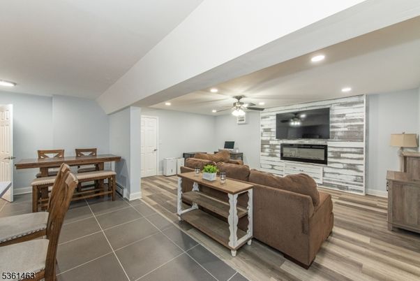 Dining room, Fireplace, Interior, Living room, Recessed Lighting, Wood Texture Flooring